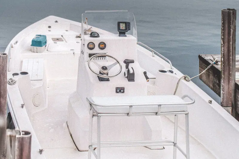 Center console boat helm at a dock