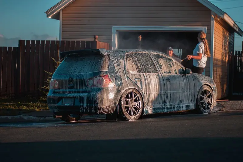 Foamed hatchback in a driveway at dusk